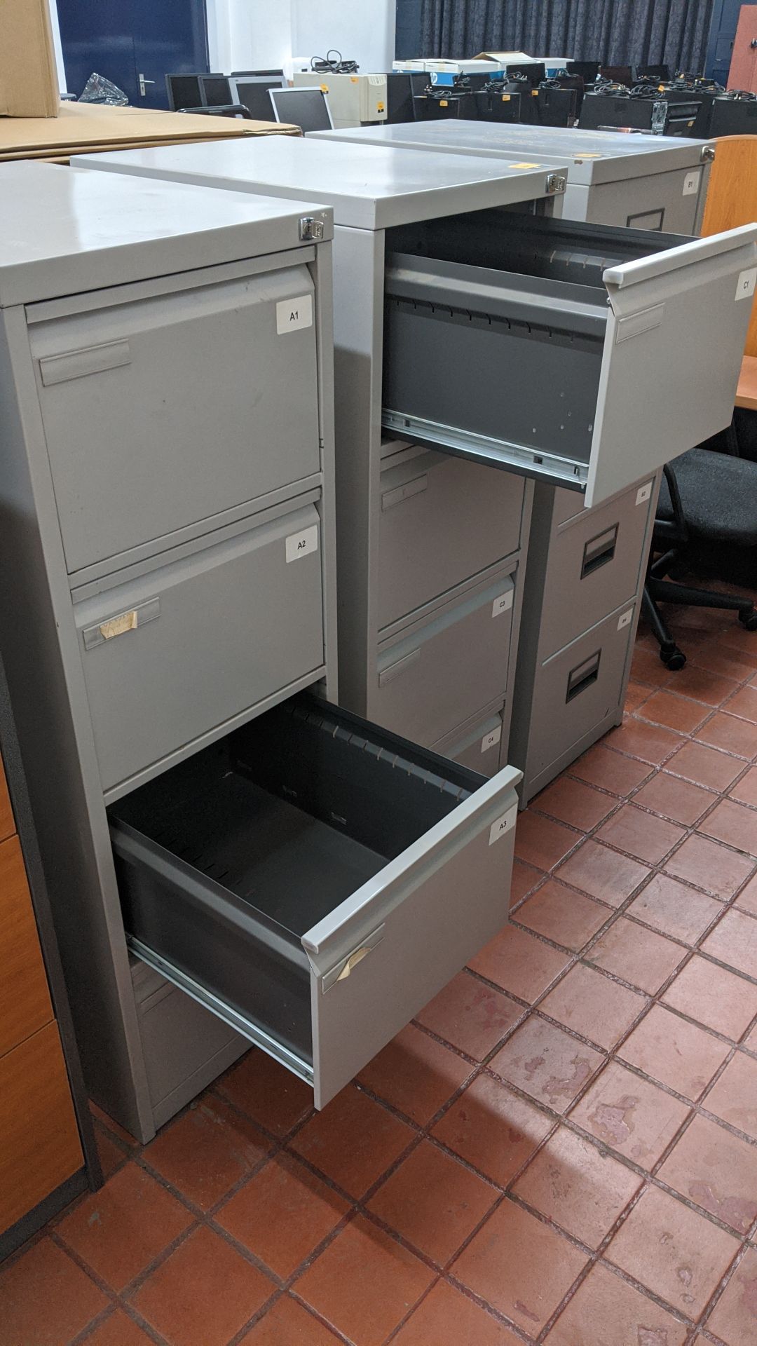 2 off matching pale grey metal 4-drawer filing cabinets with keys. This is one of a large number - Image 4 of 4