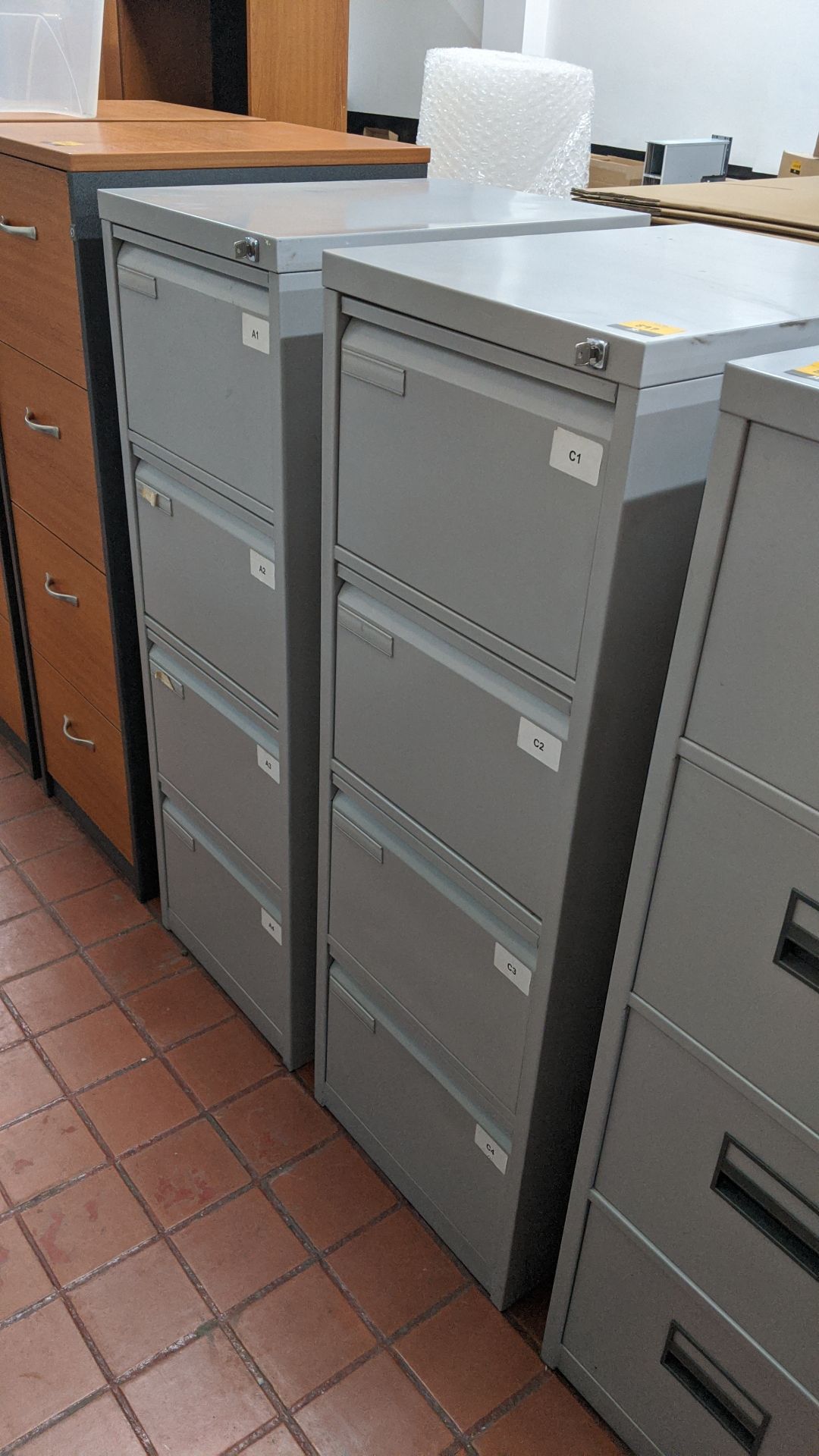 2 off matching pale grey metal 4-drawer filing cabinets with keys. This is one of a large number - Image 2 of 4