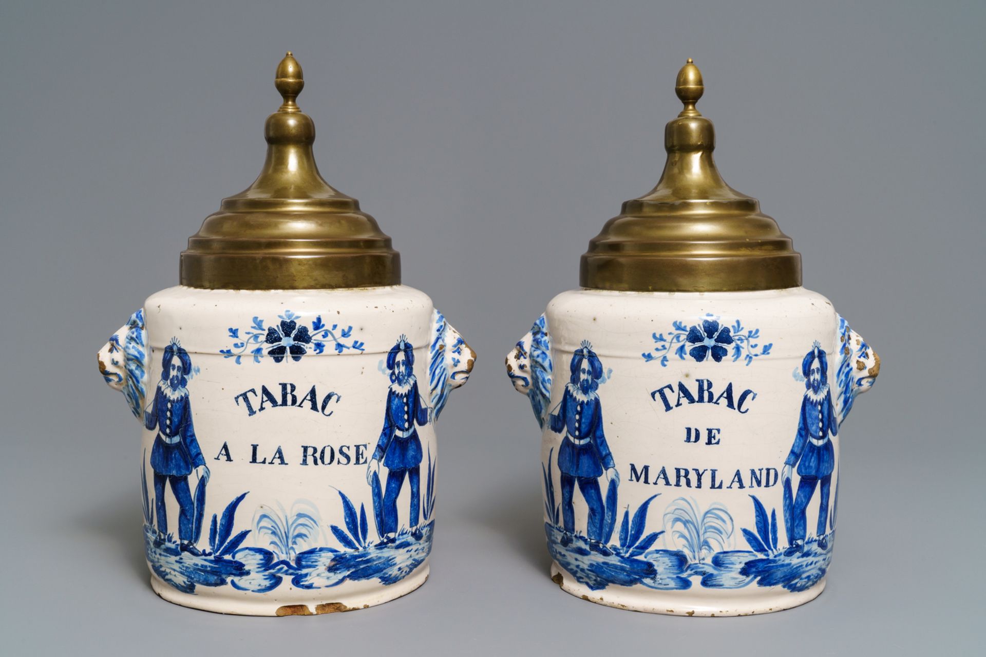 A pair of blue and white Brussels faience tobacco jars, late 18th C.