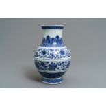 A Chinese blue and white 'flower scroll' vase, Qianlong mark, 19/20th C.