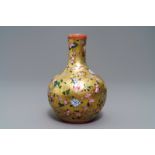 A Chinese famille rose gilt-ground bottle vase with floral design, Qianlong mark, 19/20th C.