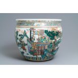 A large Chinese famille verte fish bowl with a narrative scene all-round, 19th C.