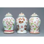 A pair of and a single Chinese famille rose covered vase with floral design, 19th C.