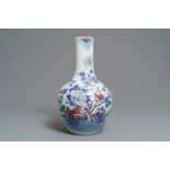 A Chinese blue, white and underglaze red 'rooster' vase, 19th C.