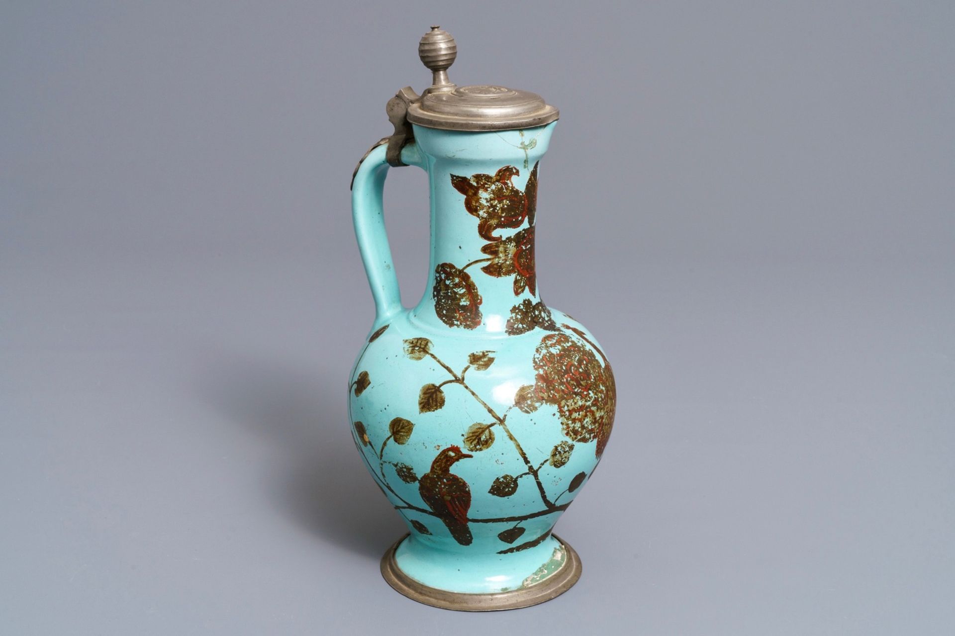 A German pewter-mounted turquoise ground ewer with birds among flowers, 17/18th C.