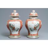 A pair of Chinese famille verte vases and covers, 19th C.