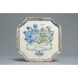 A Dutch Delft polychrome armorial marriage plaque, ca. 1704