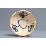 A Spanish blue and white armorial bowl, 16/17th C.