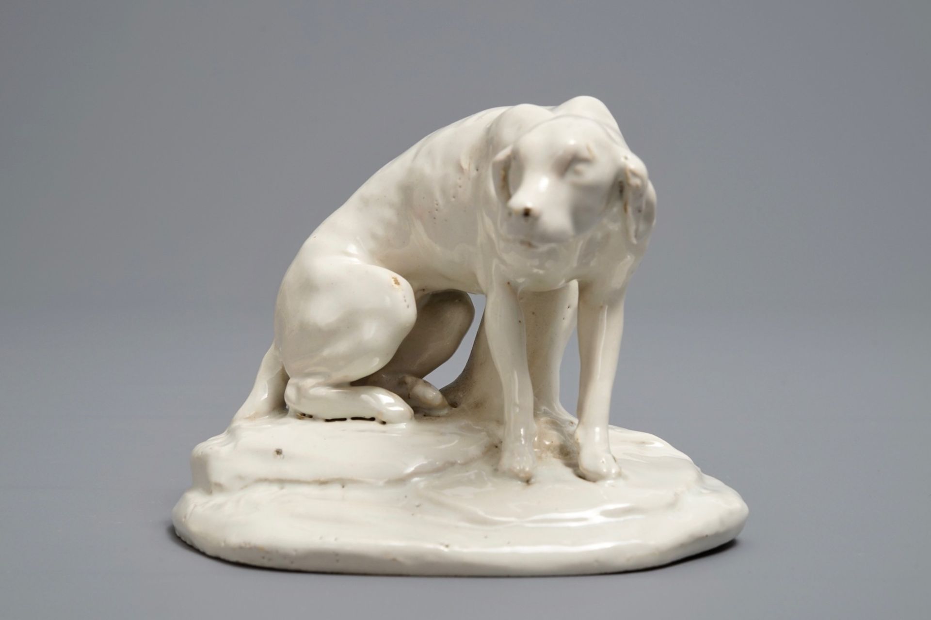 A white Dutch Delft model of a dog, 18th C. - Image 2 of 7