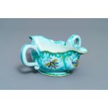 A Brussels faience sauce boat with butterflies and caterpillars, late 18th C.