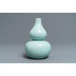 A Chinese monochrome celadon double gourd vase, Qianlong mark, 19th C.