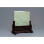 A Chinese carved pale celadon jade and hardwood table screen, 19/20th C.