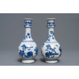 A pair of Chinese blue and white vases with antiquities and flowers, kangxi