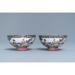 A pair of Chinese Canton enamel bowls with figures in a landscape, Yongzheng/Qianlong