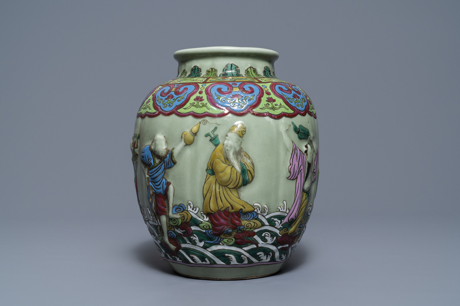 A Chinese relief-decorated famille rose celadon-ground vase, 19/20th C. - Image 5 of 7