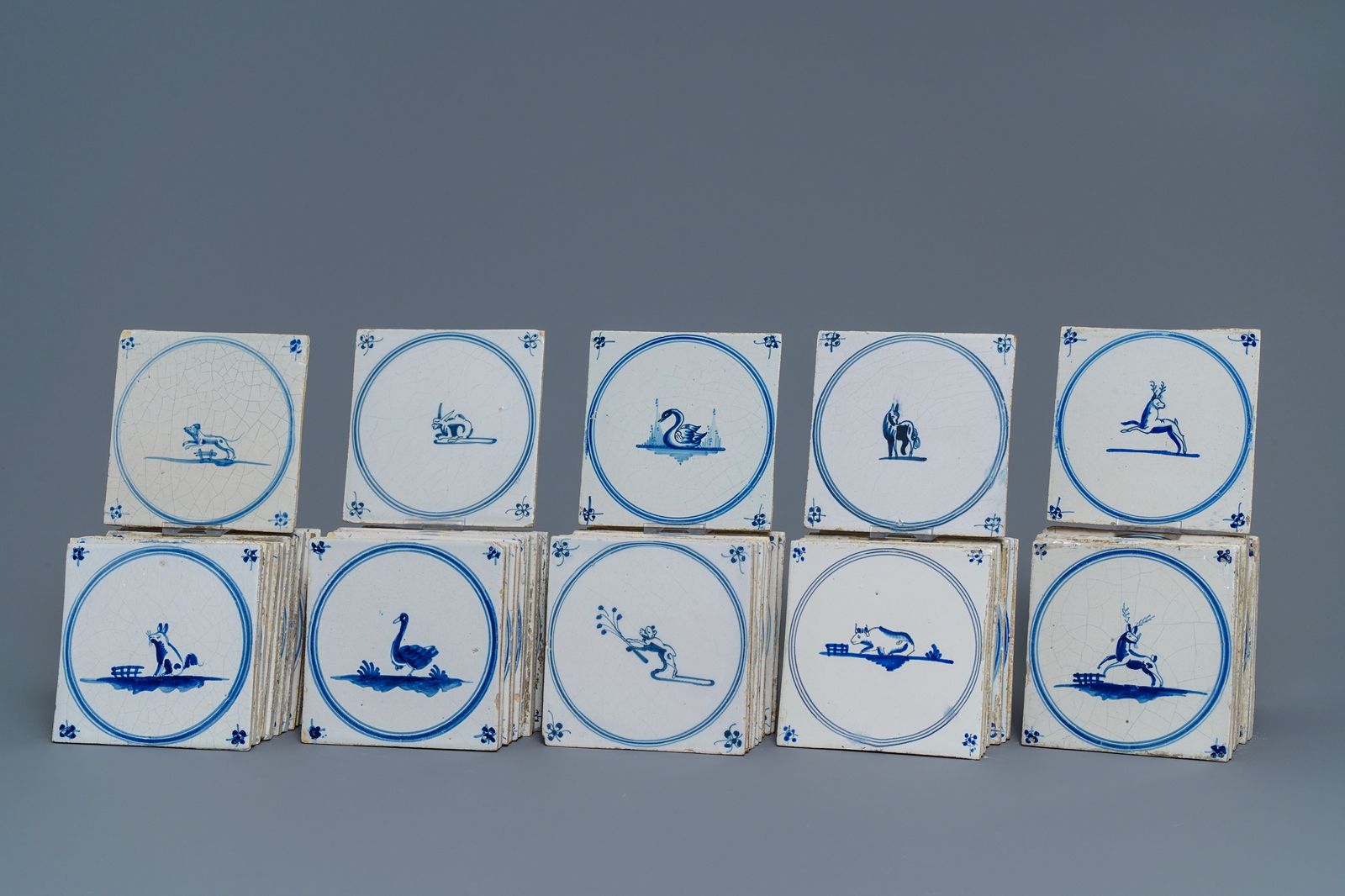 54 Dutch Delft blue and white 'animal' tiles, 18/19th C.