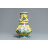 A Chinese yellow ground famille rose bottle vase with antiquities design, Yongzheng