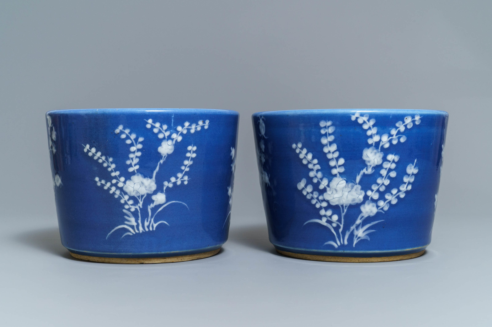 A pair of Chinese blue ground slip-decorated jardinires, 19th C. - Image 4 of 6