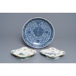 A Chinese blue and white charger and two famille rose bowls, 19th C.