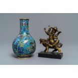 A Chinese cloisonnŽ bottle vase and a gilt bronze group, 18/19th C.