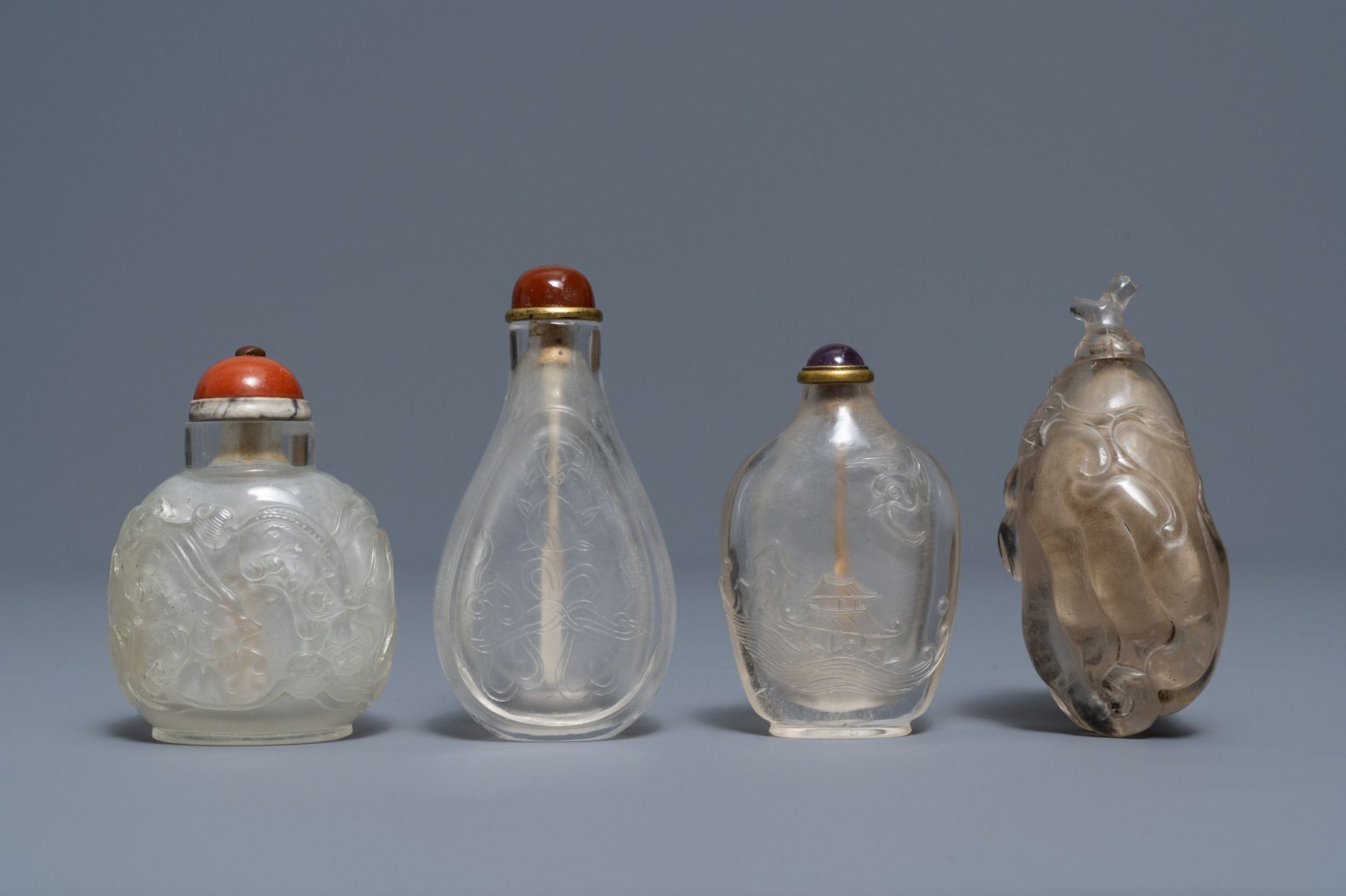 Four Chinese smokey quartz and rock crystal snuff bottles, 18/19th C.