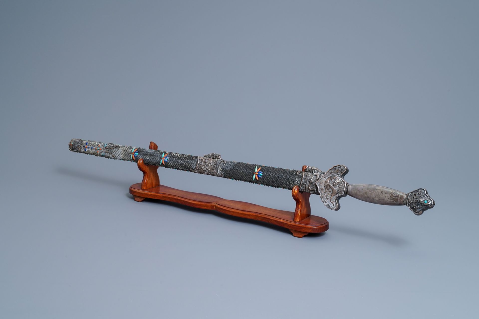 A Chinese coral-, lapis lazuli- and turquoise-inlaid silver sword, 19th C.