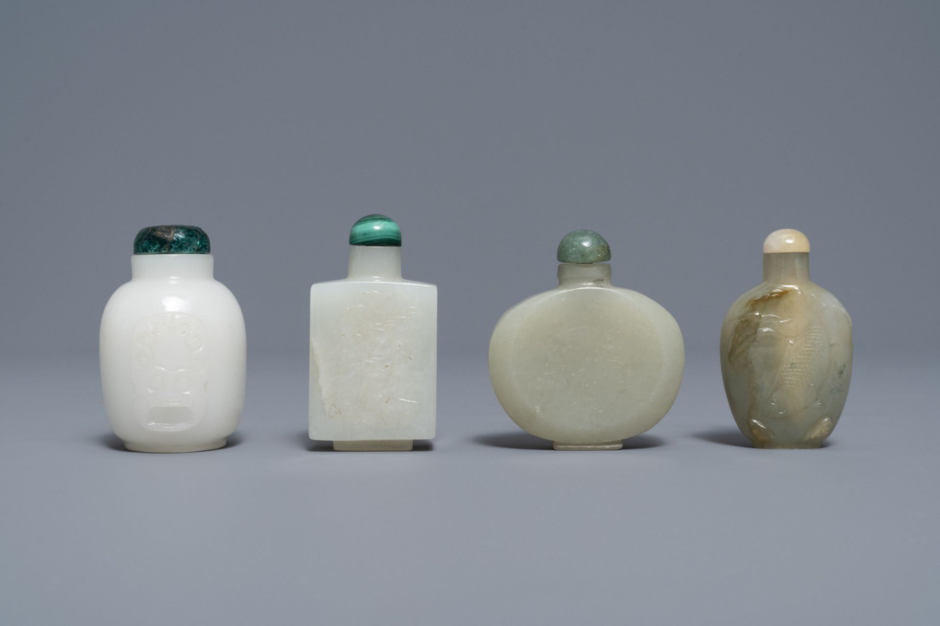 Four Chinese white and celadon jade snuff bottles, 19/20th C.