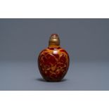 A Chinese carved realgar glass snuff bottle, Imperial Glassworks, Beijing, 1730-1840