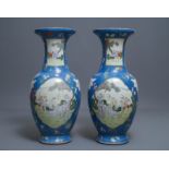 A pair of large Chinese blue-ground famille rose vases with figural design, Qianlong mark, 19th C.