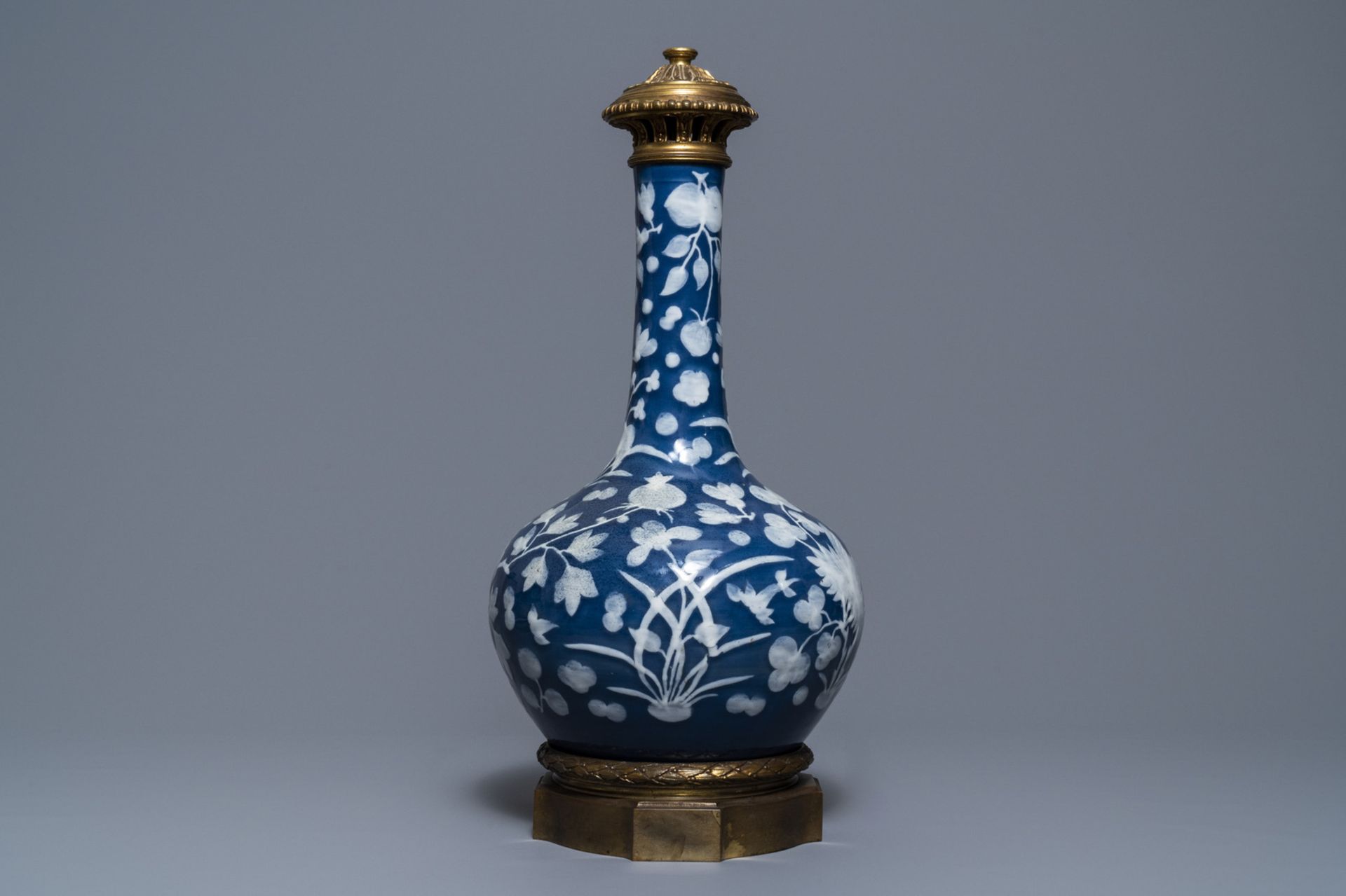 A Chinese blue-ground slip-decorated bottle vase with ormolu mounts, 19th C. - Image 2 of 7