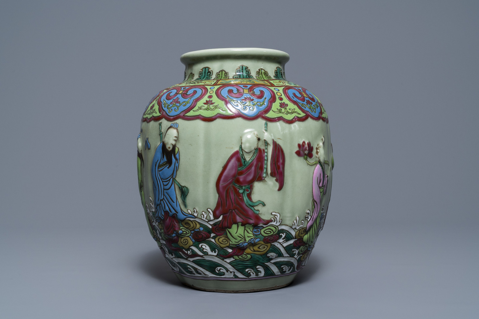 A Chinese relief-decorated famille rose celadon-ground vase, 19/20th C. - Image 3 of 7