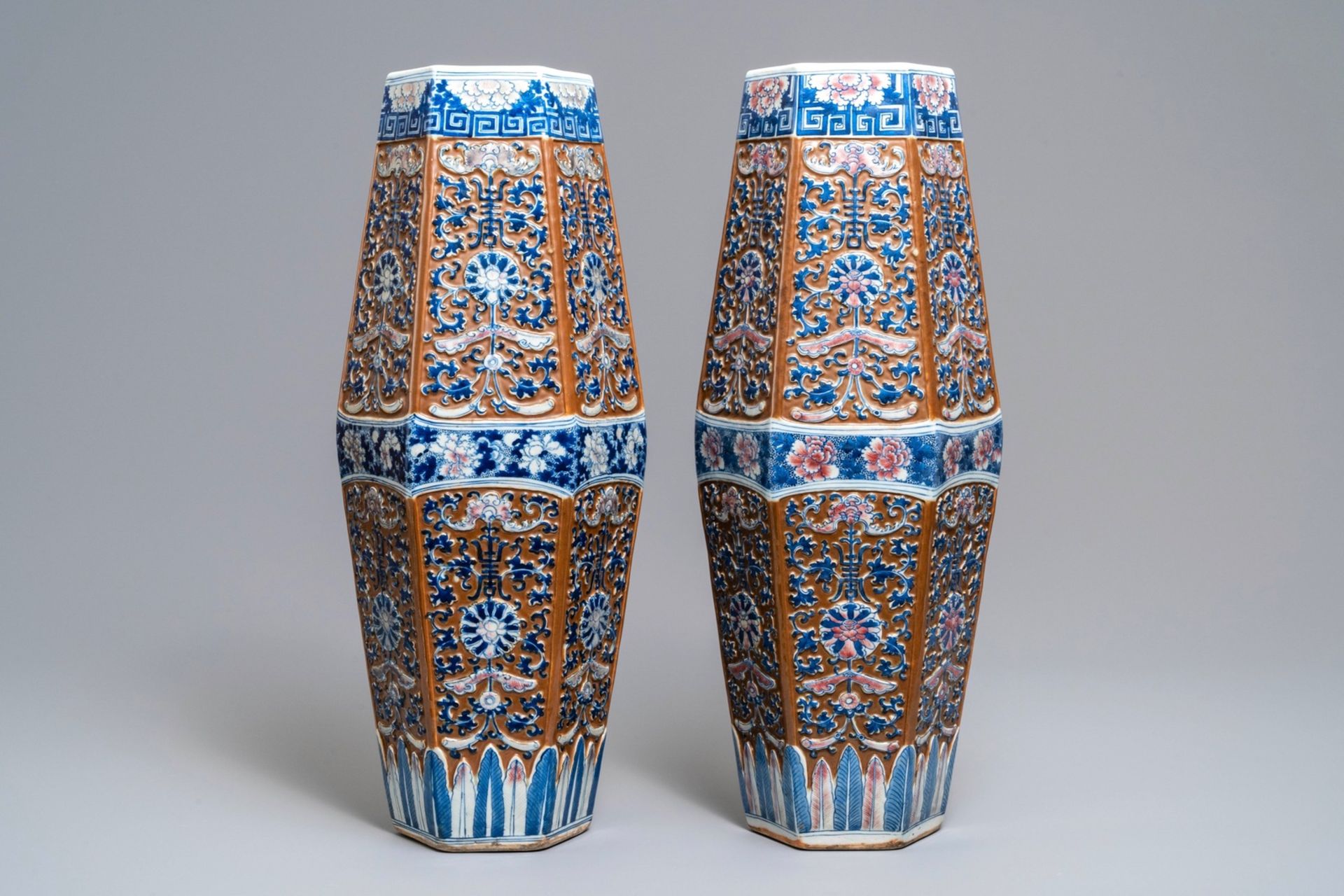 A pair of rare Chinese hexagonal brown-ground blue, white and iron red vases, 19th C.