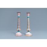 A pair of Chinese Canton enamel candlesticks with floral design, Yongzheng