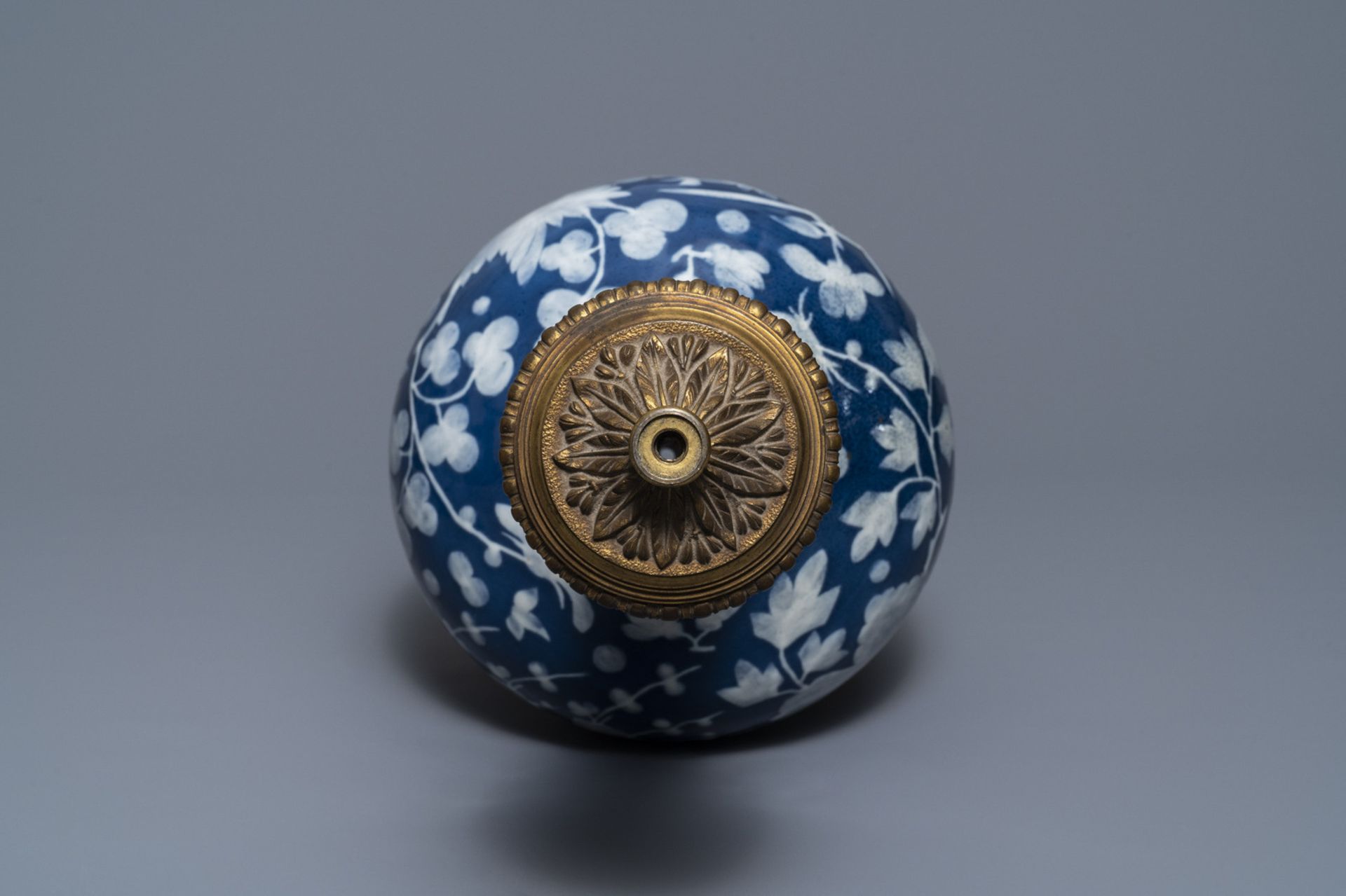 A Chinese blue-ground slip-decorated bottle vase with ormolu mounts, 19th C. - Image 7 of 7