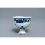 A Chinese blue and white stem cup with landscape design, Transitional period