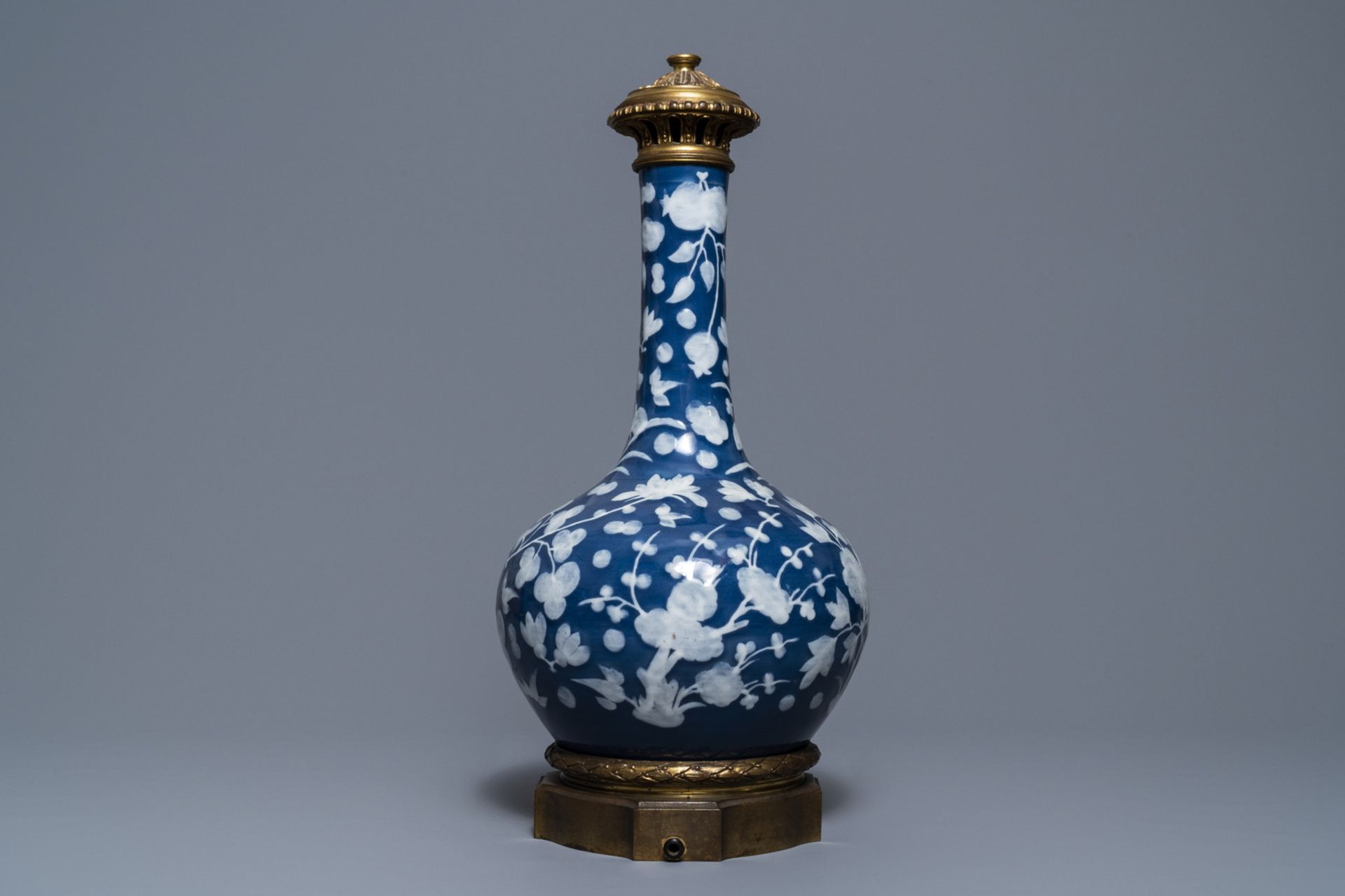 A Chinese blue-ground slip-decorated bottle vase with ormolu mounts, 19th C. - Image 4 of 7