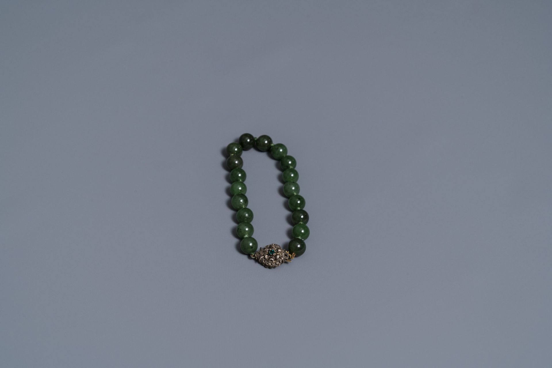 Two Chinese necklaces and a bracelet with spinach green jade beads, 20th C. - Image 2 of 5