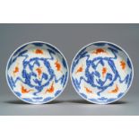 A pair of Chinese blue, white and iron red 'bats and clouds' plates, Guangxu mark, 19/20th C.