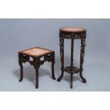 Two Chinese carved wooden stands with marble tops, 19/20th C.