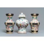 A pair of Chinese famille rose Nanking vases and a covered vase, 19th C.