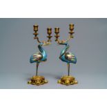 A pair of Chinese cloisonnŽ gilt bronze candelabra mounted cranes, 18/19th C.