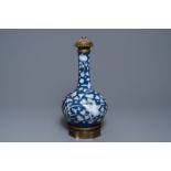 A Chinese blue-ground slip-decorated bottle vase with ormolu mounts, 19th C.