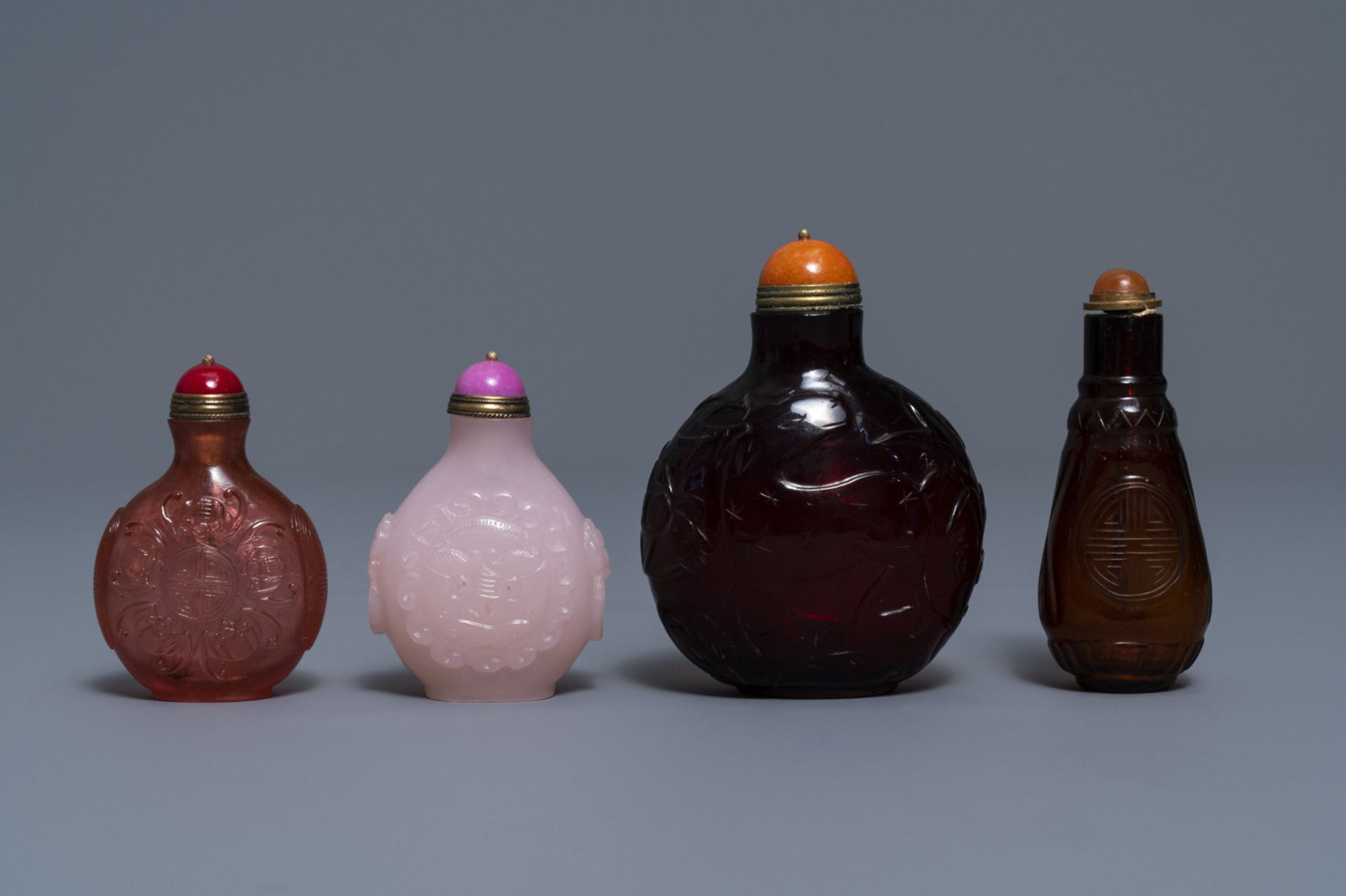 Four Chinese cherry red and pink glass snuff bottles, 19/20th C.