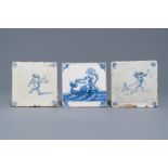 Three Dutch Delft blue and white putti and seacreature tiles, 17th C.