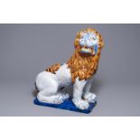 A massive French faience model of a lion, Rouen, 19th C