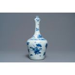 A Chinese blue and white bottle vase with floral design, Transitional period