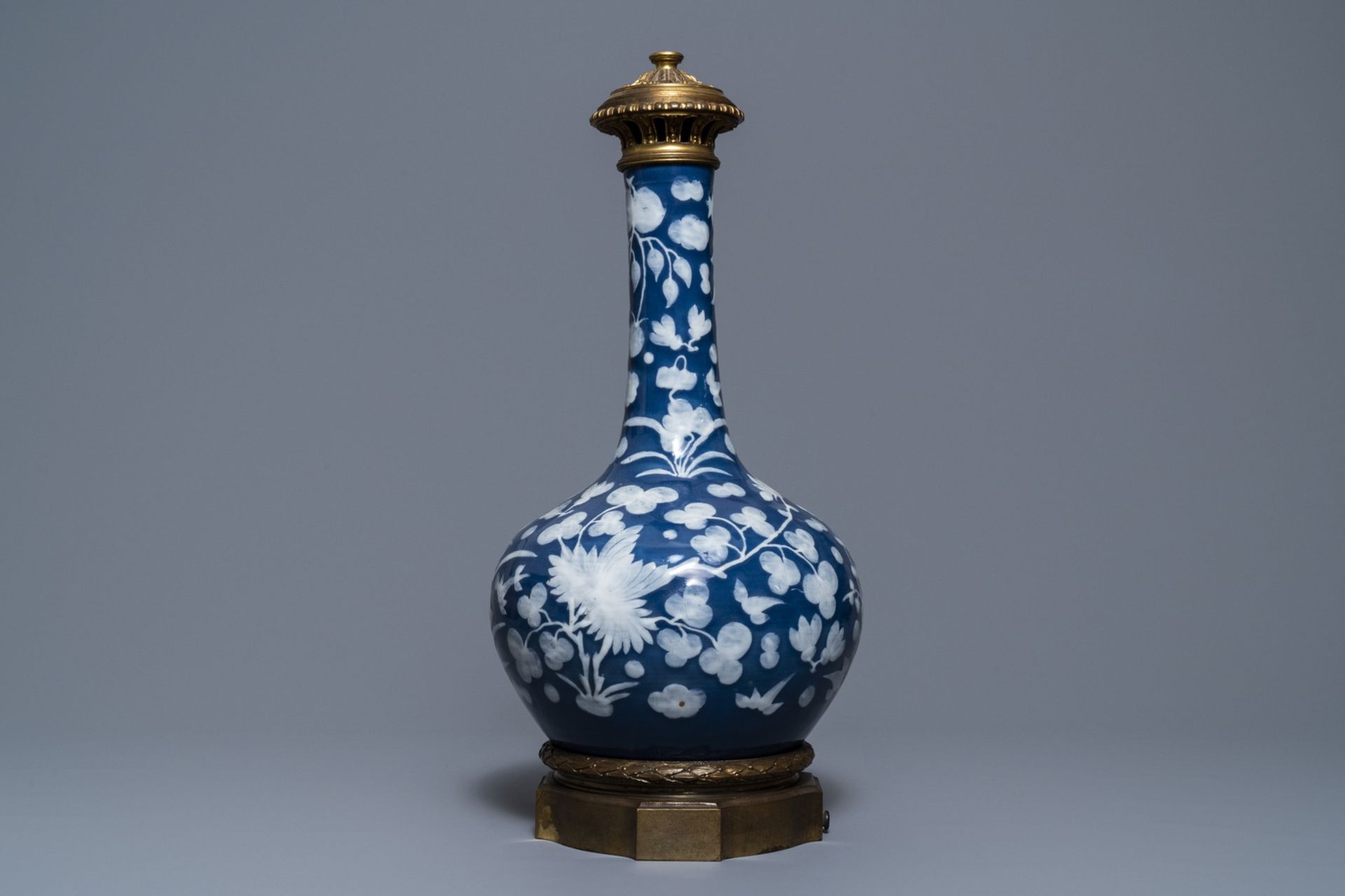 A Chinese blue-ground slip-decorated bottle vase with ormolu mounts, 19th C. - Image 5 of 7