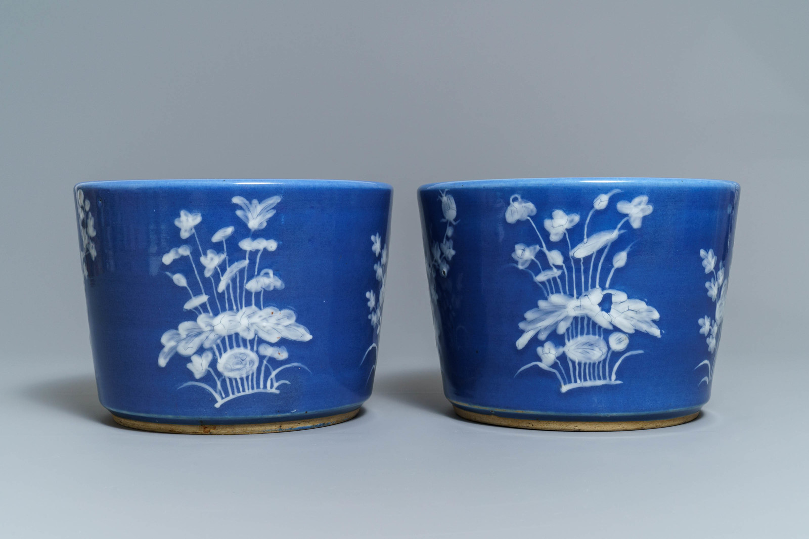 A pair of Chinese blue ground slip-decorated jardinires, 19th C. - Image 2 of 6