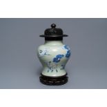 A Chinese underglaze red, blue and white celadon-ground vase, Kangxi