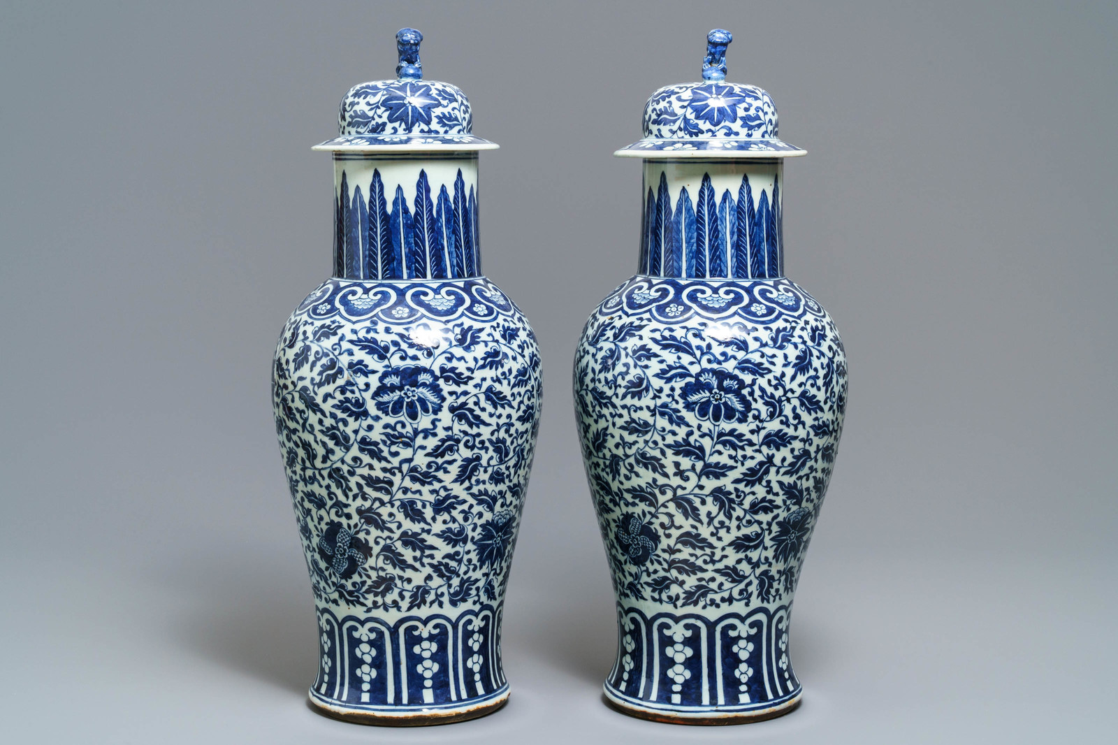 A pair of Chinese blue and white vases and covers with floral sprigs, 19th C. - Image 2 of 6